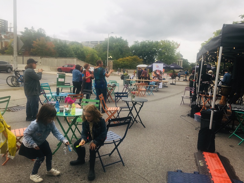 people enjoying themselves on gaukel street during the pop-up park